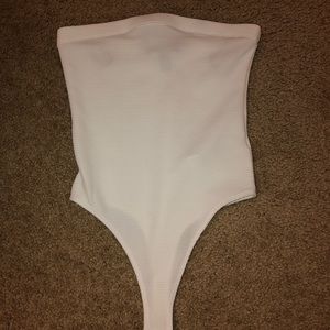 white sleeveless body suit. brand new!
